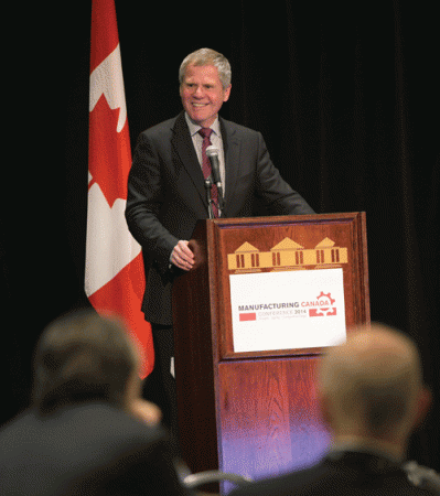 Jayson Myers at the podium during the Manufacturing Canada 2014 conference. PHOTO: Donna Santos