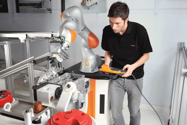 A LBR iiwa, a robotic assistant, working collaboratively with humans to increase productivity in manufacturing and materials handling. PHOTO: KUKA SYSTEMS.