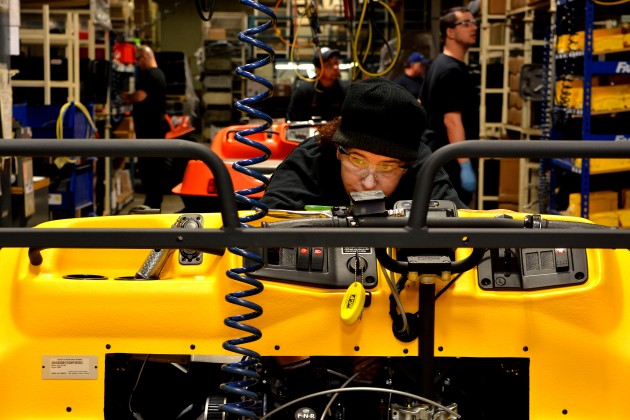Assembly worker Susan Dixon wires an ARGO engine before testing. PHOTO: STEPHEN UHRANEY