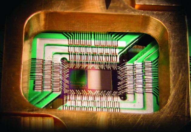A D-wave Systems chip using 128 superconducting logic elements that exhibit controllable and tunable coupling to perform operations. PHOTO: D-Wave